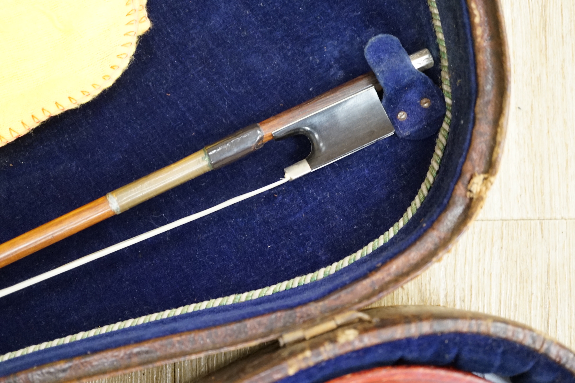 An English cased violin by Thomas J. Bellingham, Leeds, 1909, body length, 35.5cm, with a chased silver mounted bow CITES Submission reference WNR7TU27